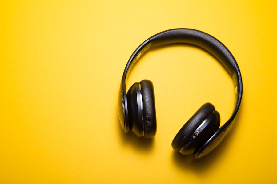 Over-ear headphones on a bright yellow surface