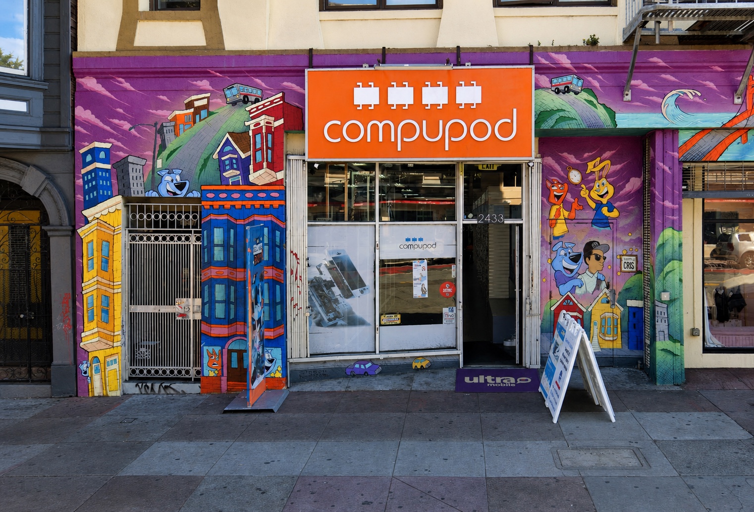 Compupod storefront at 2433 Mission Street with its colorful neighborhood mural